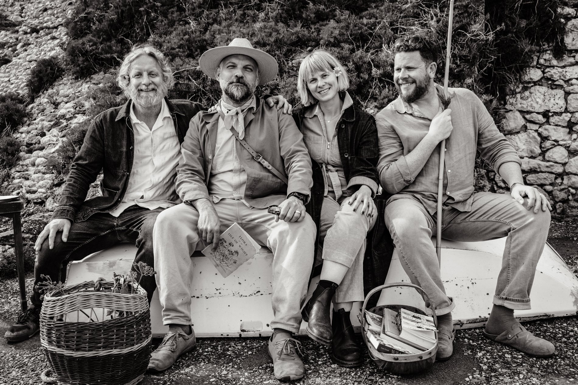 The Somewhen Survival Society team, seated together outdoors on the Isle of Wight